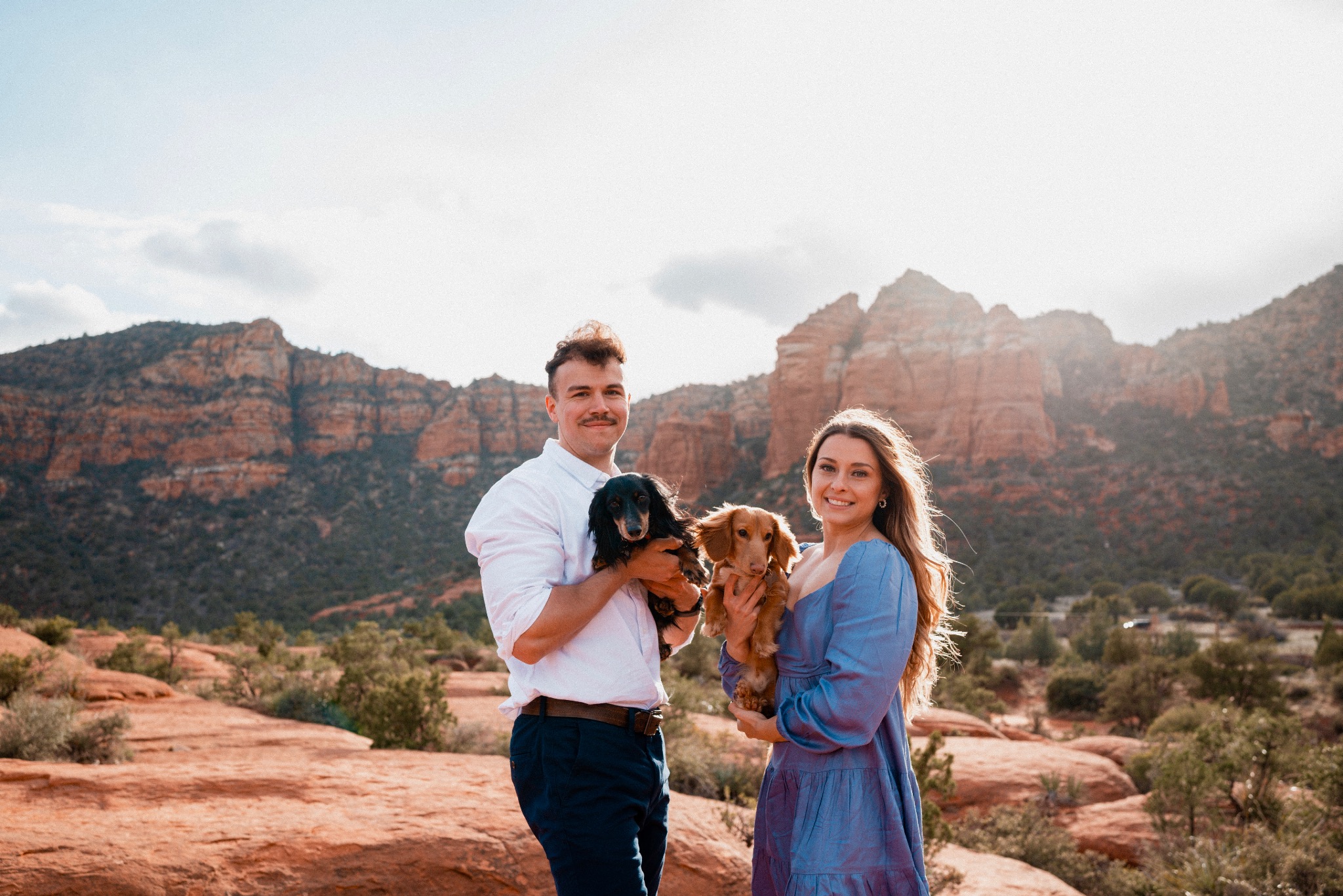 Jess with her husband and dogs outdoors in Sedona, Arizona